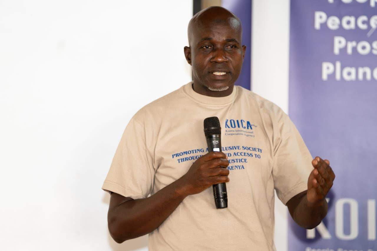 A facilitator leading a rights and access-to-justice training session